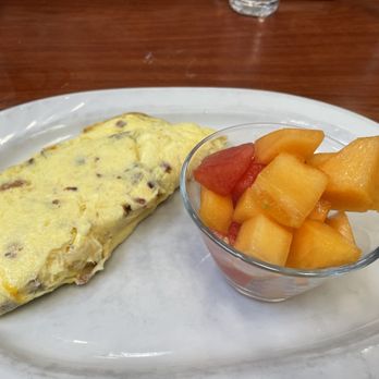 Friends Cafe - Very plain looking cheese and bacon omelette and fruit. - Breakfast & Brunch Near Me - Tustin, California Friends Cafe - Very plain looking cheese and bacon omelette and fruit. - Breakfast & Brunch Near Me - Tustin, California