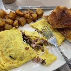 Kevin's Restaurant - Ham mushroom and Swiss cheese omelette with home fries and white toast