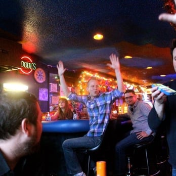 Ships Lounge - a group of people at a bar - Dive Bars Near Me - Dallas, Texas