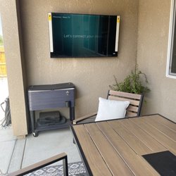 Call Curtis - 58" tv mounted and added an electrical outlet behind the TV