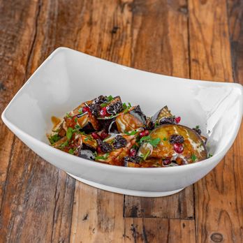 Alkofeia Restaurant - a bowl of food on a wooden table - Middle Eastern Near Me - Bayonne, New Jersey