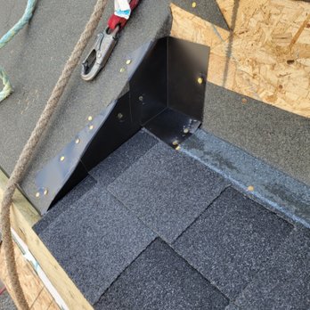 Marchuk Roofing - How the metal bends up the wall - Roofing Near Me - Calgary, Alberta Marchuk Roofing - How the metal bends up the wall - Roofing Near Me - Calgary, Alberta