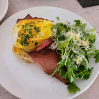 Toast Kitchen & Bar - Half of a classic egg Benedict with lemon arugula salad - Breakfast & Brunch Near Me - Brea, California Toast Kitchen & Bar - Half of a classic egg Benedict with lemon arugula salad - Breakfast & Brunch Near Me - Brea, California