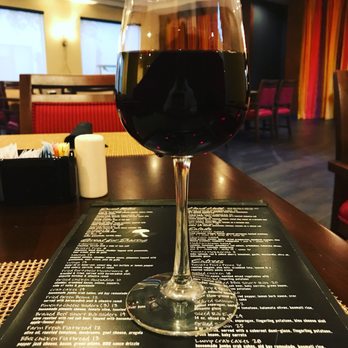 Newtons Restaurant & Lounge - a glass of wine on a table - American Near Me - Durham, North Carolina Newtons Restaurant & Lounge - a glass of wine on a table - American Near Me - Durham, North Carolina