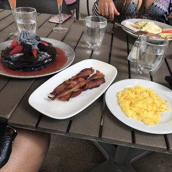 Basalt - Charcoal pancakes, bacon, side of scramble eggs, pork fried rice and guava mimosas. - New American Near Me - Honolulu, Hawaii