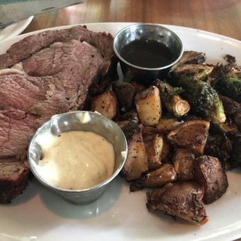 Longleaf - Green egg smoked prime rib, big enough to share. Rosemary roasted potatoes and brussels sprouts. You can really taste the smoked meat - New American Near Me - Atlanta, Georgia