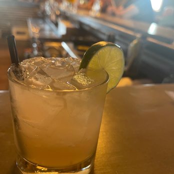 Wolf Pack Woodfired Tavern - a cocktail with a lime slice - American Near Me - Sealy, Texas Wolf Pack Woodfired Tavern - a cocktail with a lime slice - American Near Me - Sealy, Texas