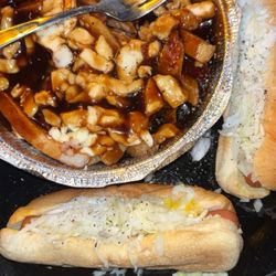 Deli Green Stop - TRIO  2 Hot Dogs  POUTINE Québécoise / Quebec was not great hard fries. Small cheese portion