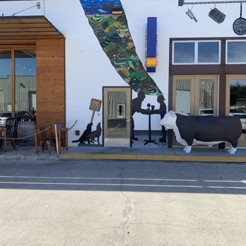 Industrial Eats - There is a tasting room in the middle of the restaurant with a large cow. - Pizza Near Me - Buellton, California Industrial Eats - There is a tasting room in the middle of the restaurant with a large cow. - Pizza Near Me - Buellton, California