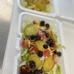 Walk 'er Drive Thru - Savage Salad. It's a hamburger in salad form. Lettuce, hamburger crumbles, shredded cheese, tomatoes, onions & pickles