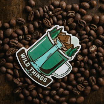 Wild Things Coffee - a bear in a cup of coffee surrounded by coffee beans - Coffee & Tea Near Me - Meridian, Idaho Wild Things Coffee - a bear in a cup of coffee surrounded by coffee beans - Coffee & Tea Near Me - Meridian, Idaho