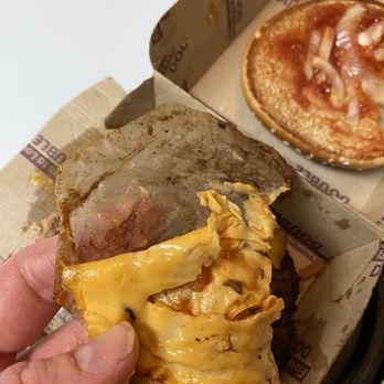 McDonald's - a hand holding a half eaten cheeseburger - Fast Food Near Me - San Jose, California McDonald's - a hand holding a half eaten cheeseburger - Fast Food Near Me - San Jose, California