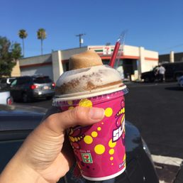 a hand holding a cup of ice cream a hand holding a cup of ice cream