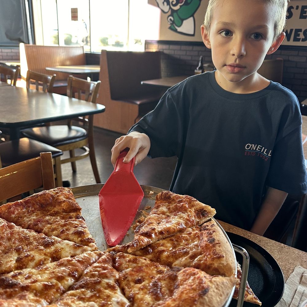 Pizza Factory - Grandson Luke getting his slice - Pizza Near Me - Hesperia, California Pizza Factory - Grandson Luke getting his slice - Pizza Near Me - Hesperia, California