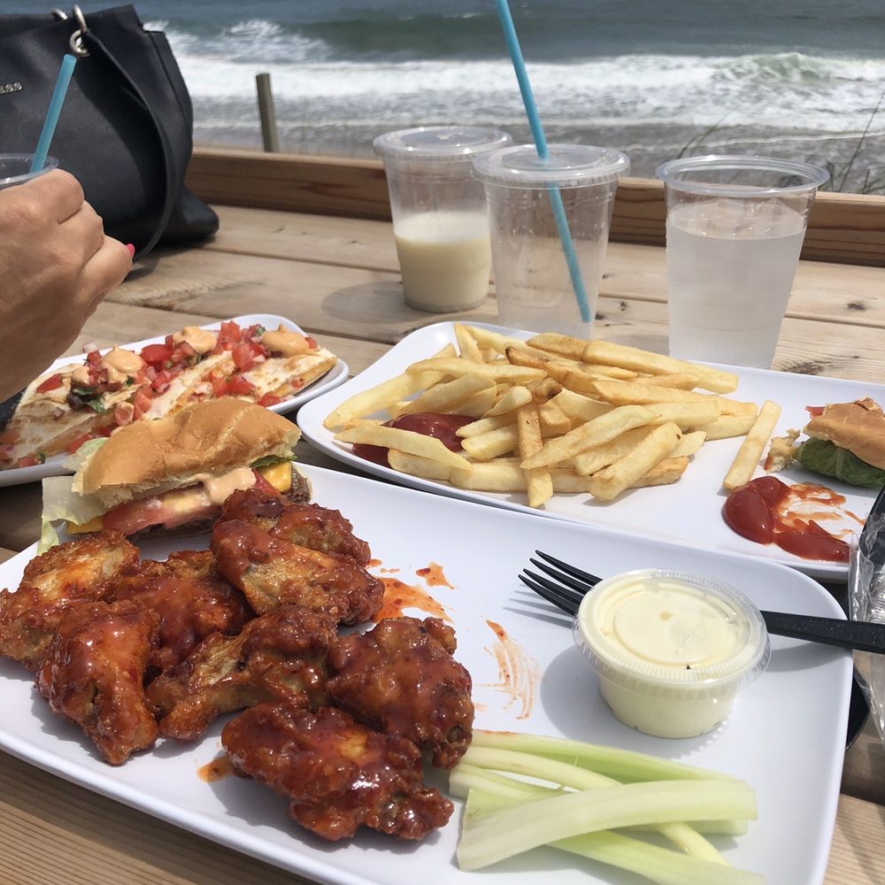 Sandbar Cafe & Lounge - a plate of wings and french fries - Lounges Near Me - New London, Connecticut Sandbar Cafe & Lounge - a plate of wings and french fries - Lounges Near Me - New London, Connecticut