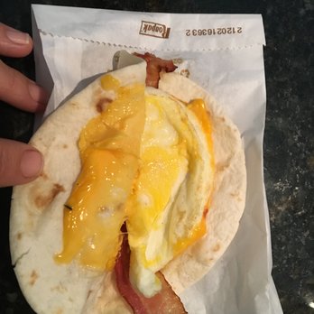 Dunkin' - Should say, "mini" with ONE slice of something that looks like it might be bacon, a cheese like substance, and something I guess egg - Coffee & Tea Near Me - Naples, Florida
