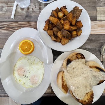 Eggscellent - Eggs, 4 biscuits with sausage gravy, and potatoes.  This was definitely enough to share with another. - Breakfast & Brunch Near Me - Las Vegas, Nevada