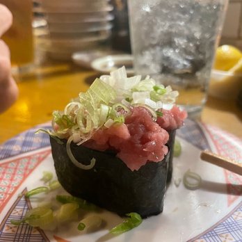 Katana - a sushi roll on a plate with chopsticks - Sushi Bars Near Me - Miami Beach, Florida Katana - a sushi roll on a plate with chopsticks - Sushi Bars Near Me - Miami Beach, Florida