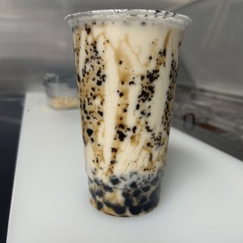 Panda Boba Tea - a cold drink in a plastic cup - Bubble Tea Near Me Panda Boba Tea - a cold drink in a plastic cup - Bubble Tea Near Me