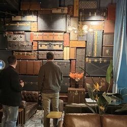 Bellhop - Wall of suitcases is pretty cool. These dudes just stared at it for hours. How do I know? I stared at them for hours.