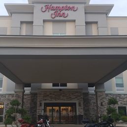Front of hotel with sign
