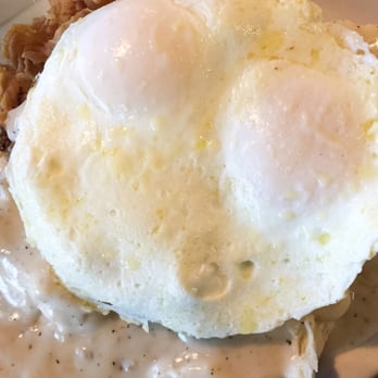 Oldwest Cafe - The 6 Shooter. Under that egg is all gravy, tons and tons of it. - Breakfast & Brunch Near Me - Bedford, Texas