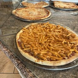 Villa Capri Pizzeria & Restaurant - Counter with various pizzas