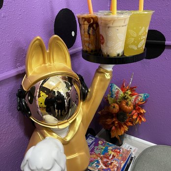 Jubi Tea - Hotspring - a statue of a dog wearing a gas mask - Bubble Tea Near Me - Hot Springs, Arkansas