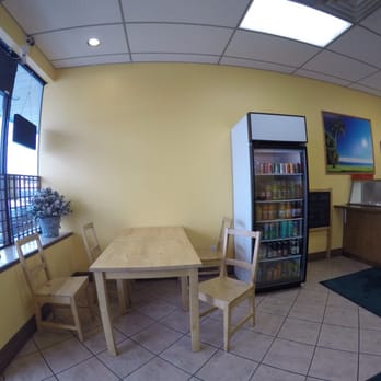 Tropical Island Caribbean Restaurant - Dining/waiting area. Table for four. - Caribbean Near Me - Vaughan, Ontario Tropical Island Caribbean Restaurant - Dining/waiting area. Table for four. - Caribbean Near Me - Vaughan, Ontario