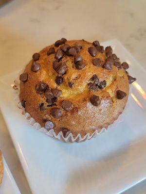 Photo of Glenview Grind - Glenview, IL, US. a chocolate chip muffin on a plate