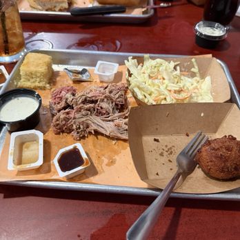 Two Drummers Smokehouse - Smoke pork plate with coleslaw and hush puppies. Served with cornbread. - Barbeque Near Me - Toano, Virginia