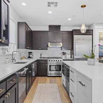 Valiente Tile - a modern kitchen with stainless steel appliances - General Contractors Near Me