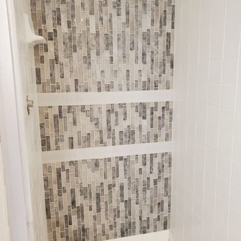 Harold White Tile Work - We had repaired a damaged shower wall and were not able to get replacement tiles, so we chose to use a mosaic to add a feature wall. - General Contractors Near Me - Riverside, California
