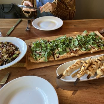 The Naked Olive - Brussel sprouts, fig jam and prosciutto flatbread, chicken skewers - Mediterranean Near Me - Kennett Square, Pennsylvania