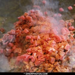 Dino's Carry Outs - Seasoning the steak tacos