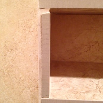 Zimmerle Floors - Niche edge: raw edge instead of bullnose, doesn't meet properly at corner. - Flooring Near Me - Clute, Texas