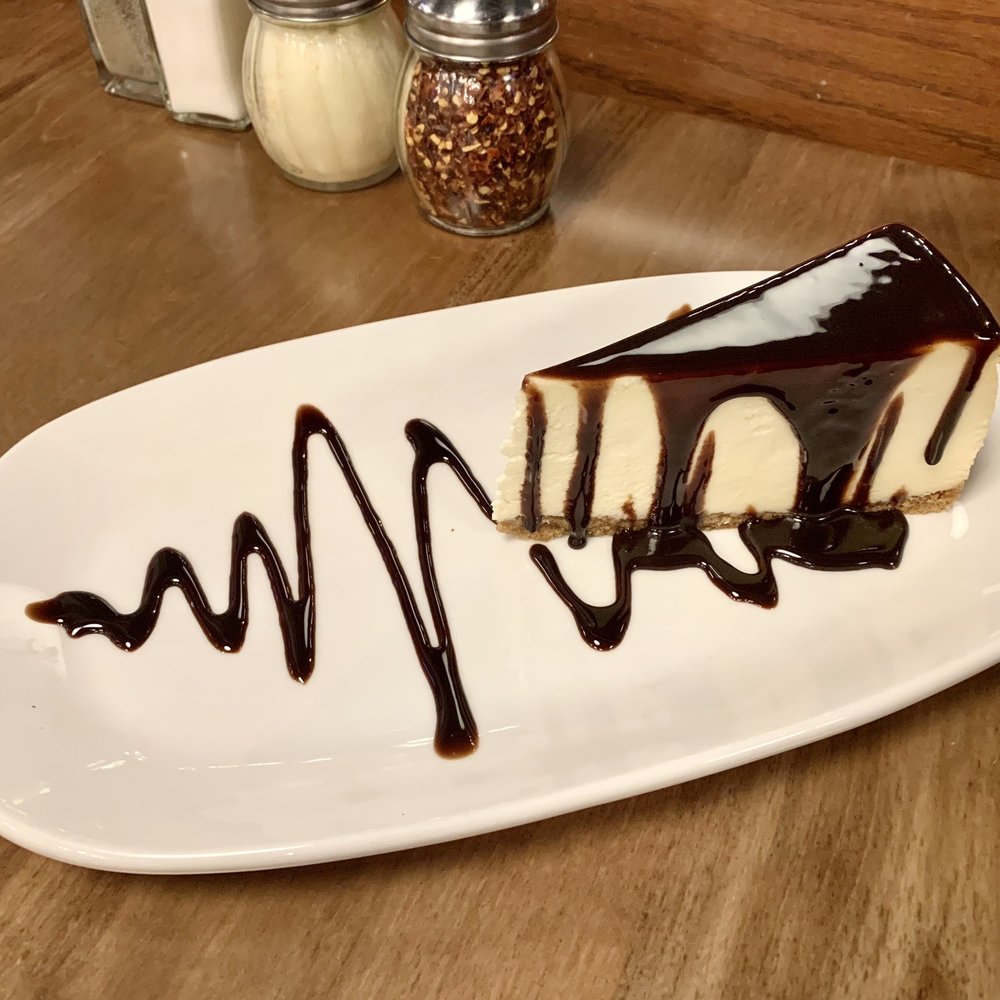 Boston Pizza - NY Cheesecake (with Chocolate Dressing) - Pizza Near Me - Winnipeg, Manitoba Boston Pizza - NY Cheesecake (with Chocolate Dressing) - Pizza Near Me - Winnipeg, Manitoba