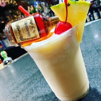 Tequila Time Bar Cafe - a drink with a pineapple garnish - Mexican Near Me - Ridgewood, New York