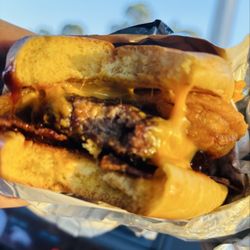 Arby's - BBQ Bacon Burger ! I forgot to eat today until now ! This burger also has cheese and onion rings on it.