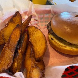 Pub West - Burger with potato wedges. The burger comes with no toppings for some reason. $9