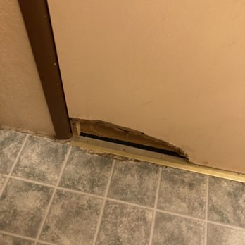 Timberline Lodge - Bathroom door- hole in both floor and door - Hotels Near Me - Big Bear Lake, California