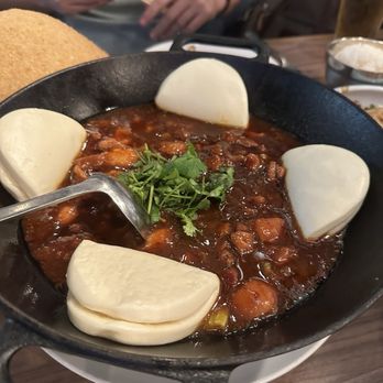 Urban Hai - M1. / Chicken Stew in Iron Pot with Brown Sauce/Spicy Sauce (With 4 Round Cake) - Chinese Near Me - Atlanta, Georgia Urban Hai - M1. / Chicken Stew in Iron Pot with Brown Sauce/Spicy Sauce (With 4 Round Cake) - Chinese Near Me - Atlanta, Georgia