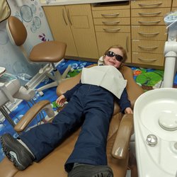 Winston Churchill Dental - My toddler on the dentistry chair all smiles after his cleaning.