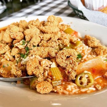 Flying Fish - a plate of food with a spoon - Seafood Near Me - Dallas, Texas Flying Fish - a plate of food with a spoon - Seafood Near Me - Dallas, Texas