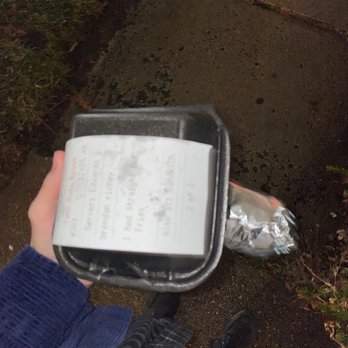 Freddy's Wings and Wraps - a person holding a box of food - Chicken Wings Near Me - Newark, Delaware