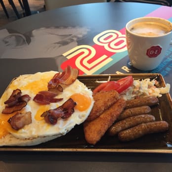 Tribune - Three egg breakfast with bacon & sausage, potatoes, bread, salad and a large coffee €11.50 - Breakfast & Brunch Near Me - Schiphol, New Hampshire