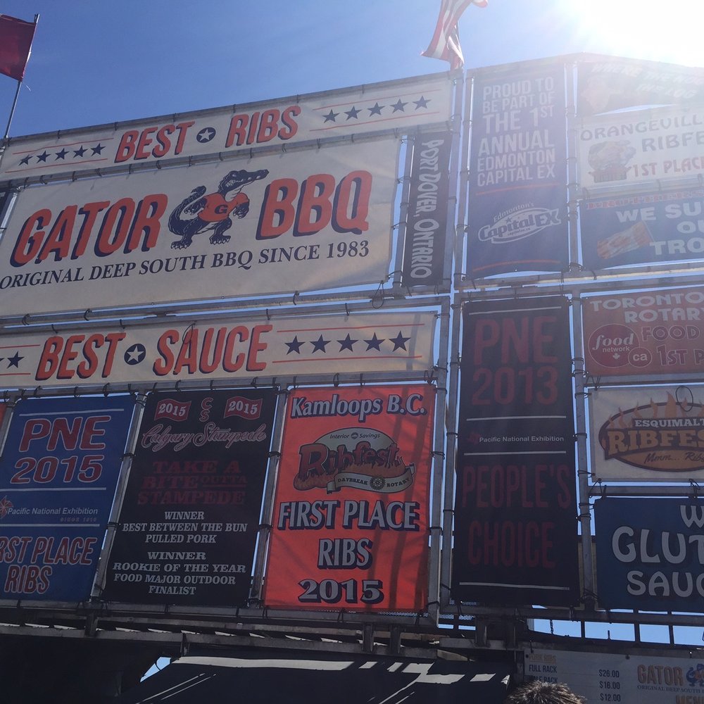 Gator Bbq - a lot of signs on the side of a building - Food Stands Near Me - Calgary, Alberta Gator Bbq - a lot of signs on the side of a building - Food Stands Near Me - Calgary, Alberta