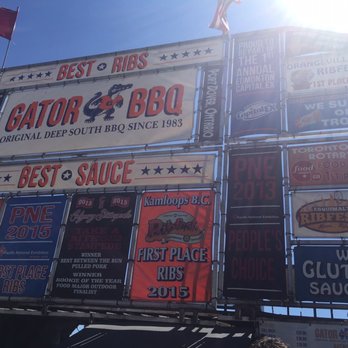 Gator Bbq - a lot of signs on the side of a building - Food Stands Near Me - Calgary, Alberta Gator Bbq - a lot of signs on the side of a building - Food Stands Near Me - Calgary, Alberta