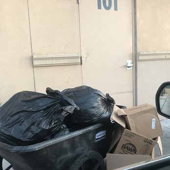 Dunkin' - a wheelbarrow full of garbage outside of a building - Donuts Near Me - Laredo, Texas Dunkin' - a wheelbarrow full of garbage outside of a building - Donuts Near Me - Laredo, Texas