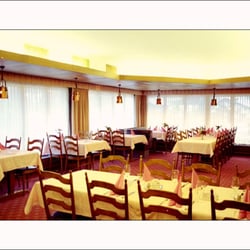 Hotel La Réserve - property's website photo of restaurant-- it really is much more charming, than this depicts, especially with the curtains drawn